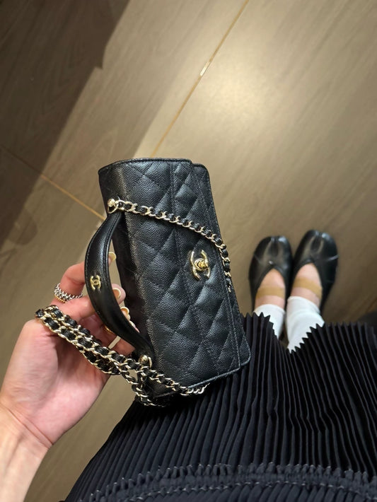 The Chanel 25C black and gold bag