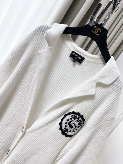 Chanel 23C white ribbed terry knit cardigan with black #5 beaded badge embroidered label