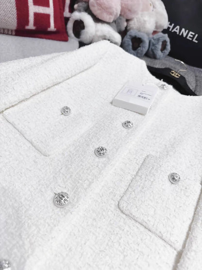 Chanel 23s jacket in white tweed with rhinestone buttons