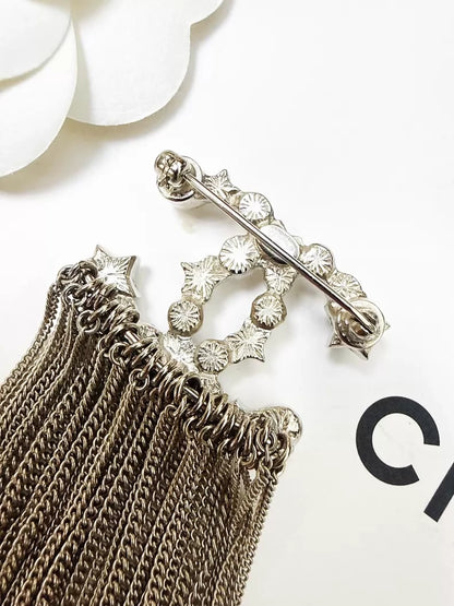 Chanel 17B pearl star double C tassel brooch