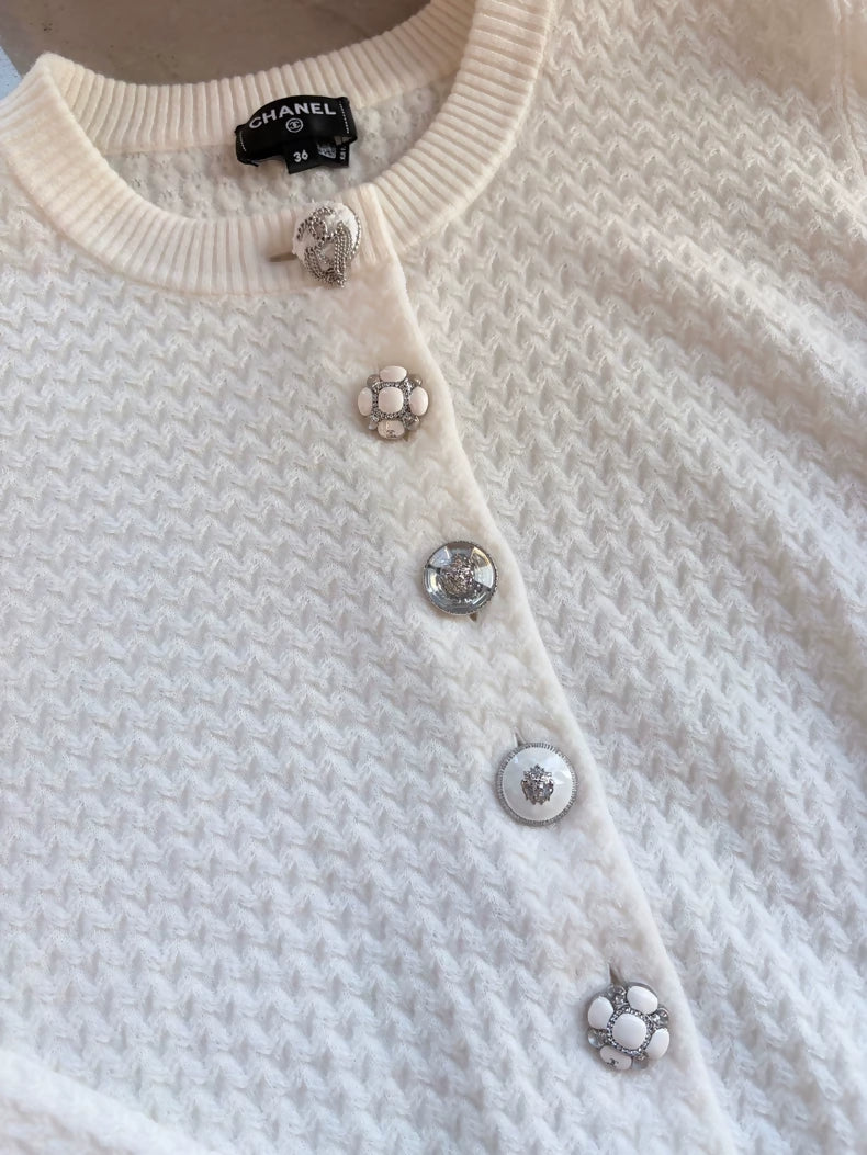 Chanel 24A white cashmere cardigan with charms buttons