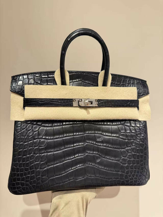 Black matte crocodile-embossed Birkin handbag with palladium hardware, single rolled top handle and turnlock closure