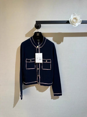 Chanel 21K navy blue round neck cardigan with pink trim