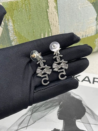 Chanel multi-element star and bow earrings