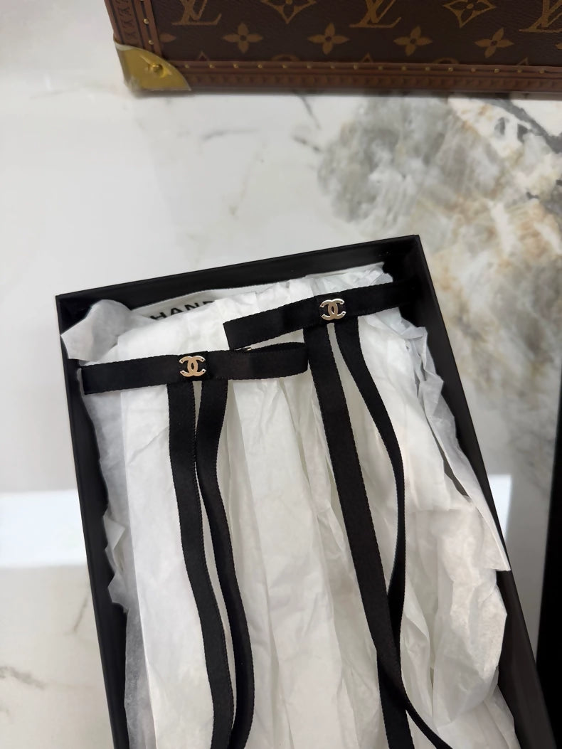 Chanel 25p black ribbon hair clip