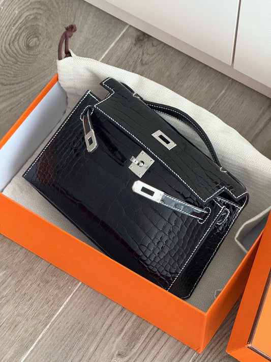 Hermès Kelly pochette black shiny crocodile leather palladium hardware
