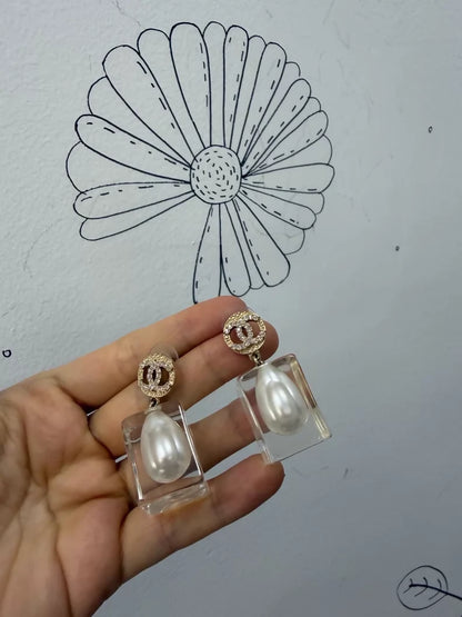 Chanel 19K gold pearl and acrylic earrings