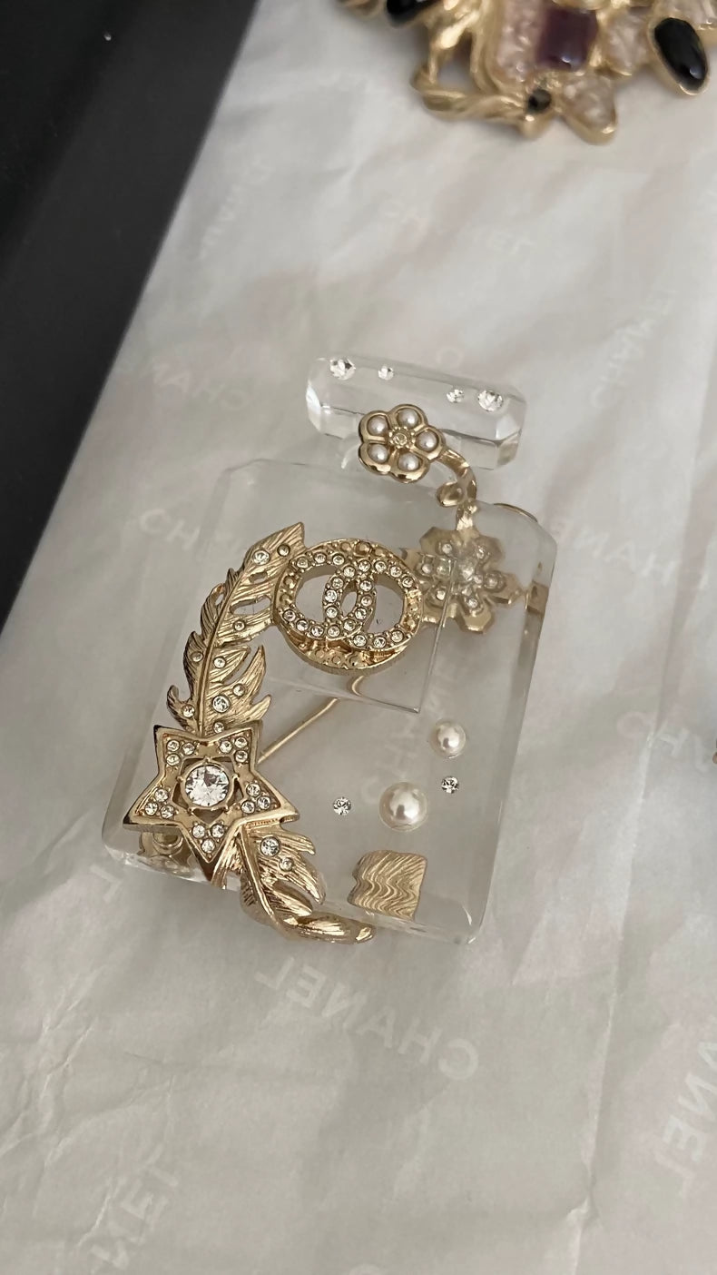 Chanel Double C perfume bottle brooch