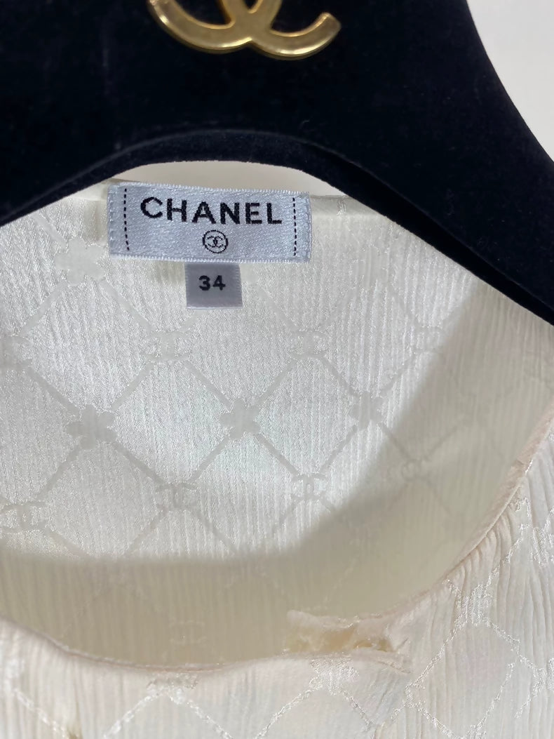 Chanel 21A beige quilted logo silk top