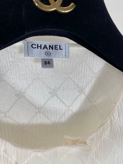 Chanel 21A beige quilted logo silk top