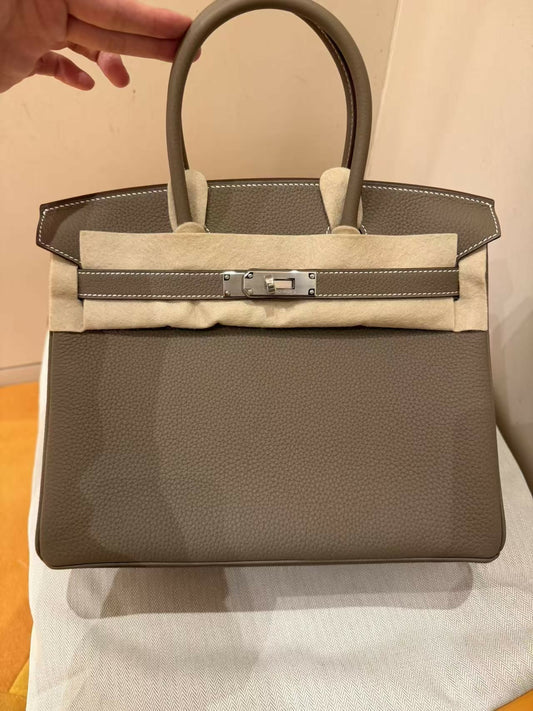 Hermès Birkin handbag in taupe grey grained leather with silver-tone hardware and white contrast stitching