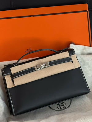 Hermès Kelly pochette Noir Swift Leather with White Contrast Stitching & Palladium Hardware