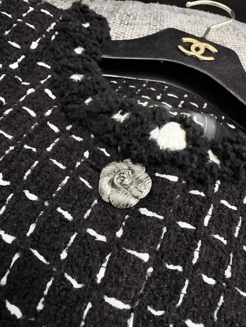 Chanel 23K black tweed jacket with white stitching