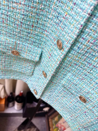 Chanel 25A light blue tweed jacket with gold lion buttons