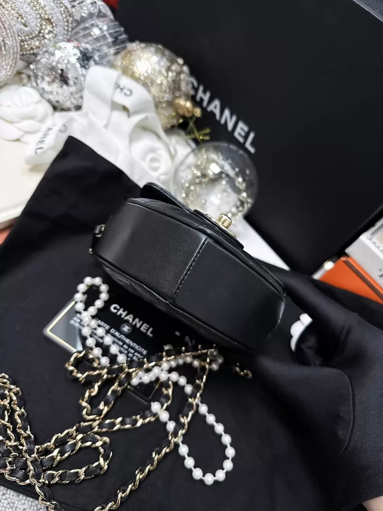 Chanel 22S black and gold quilted heart-shaped crossbody bag
