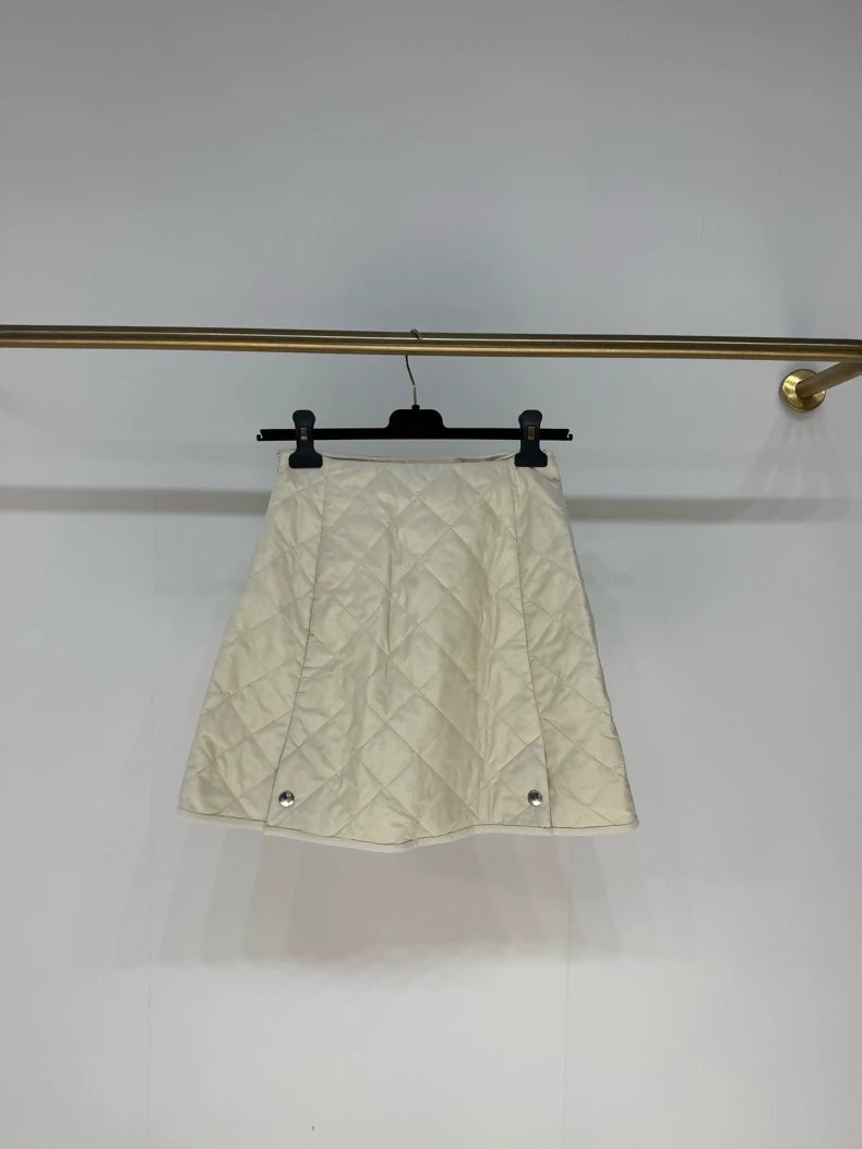 Prada 2025 skirt in cream white nylon with diamond pattern and triangular logo