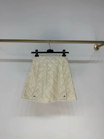 Prada 2025 skirt in cream white nylon with diamond pattern and triangular logo