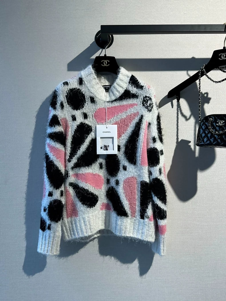 Chanel 23k runway pink, white, and black color-blocked floral sweater,
