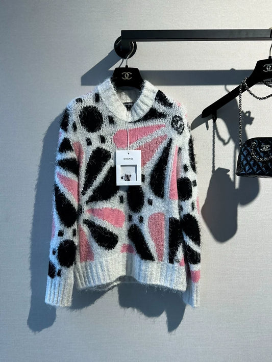 Chanel 23k runway pink, white, and black color-blocked floral sweater,