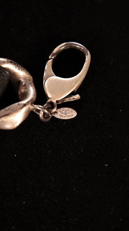 Chanel black and silver leather chain with a rhinestone CC pendant and double waist chain