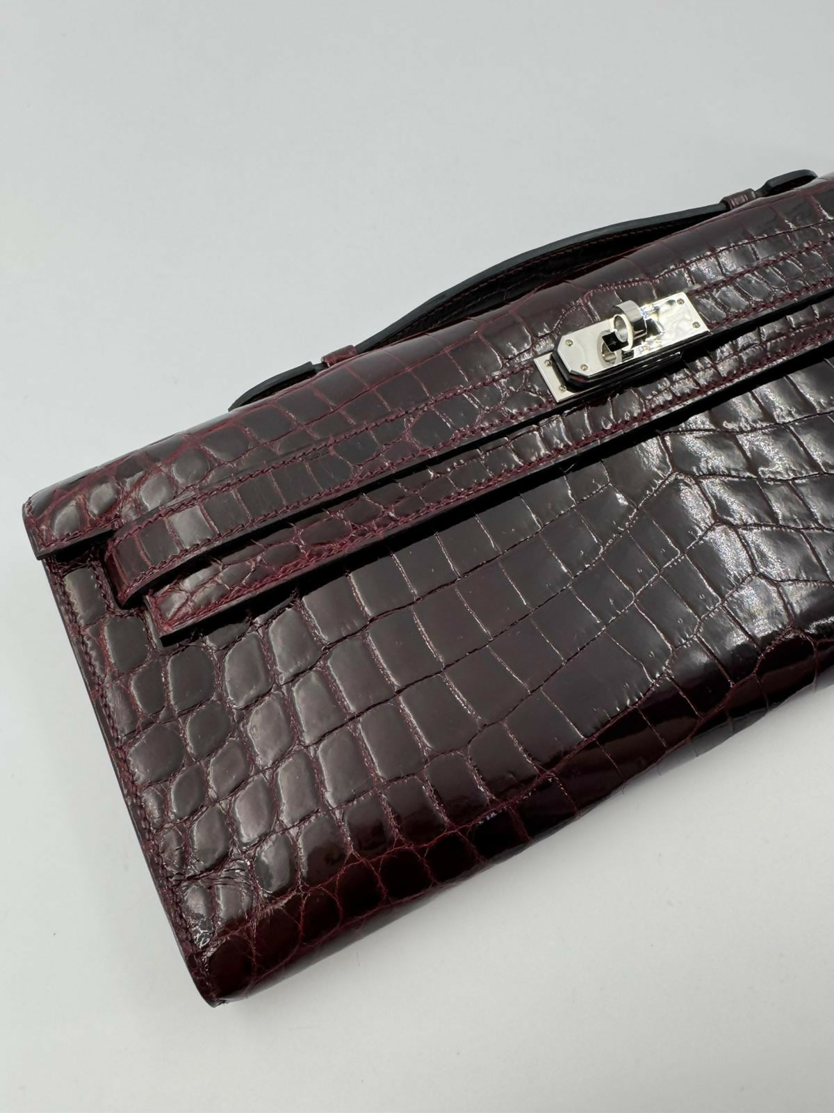 Hermès Kelly Cut Bag in Bordeaux Shiny Porosus Crocodile Leather with PHW
