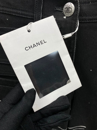 The Chanel 22C black and white graffiti denim pants