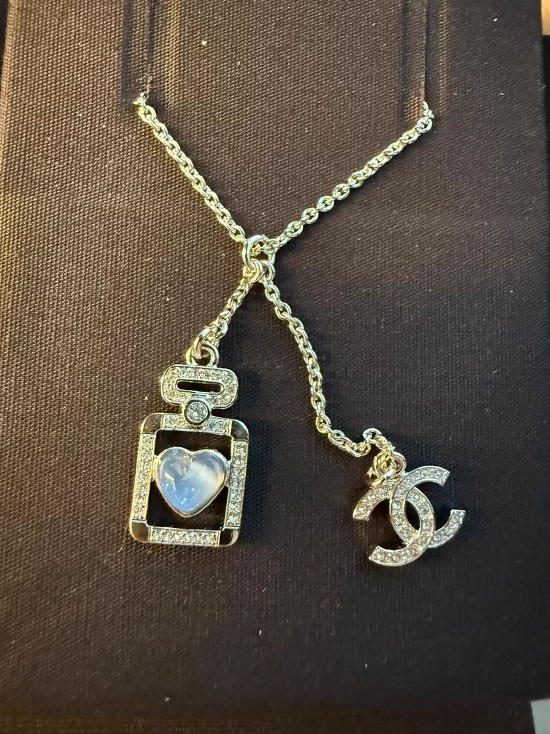 Chanel 25p perfume bottle heart necklace