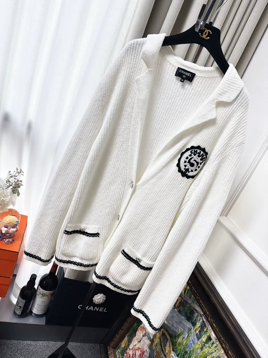 Chanel 23C white ribbed terry knit cardigan with black #5 beaded badge embroidered label