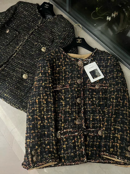 Chanel 19k black 
gold tweed jacket