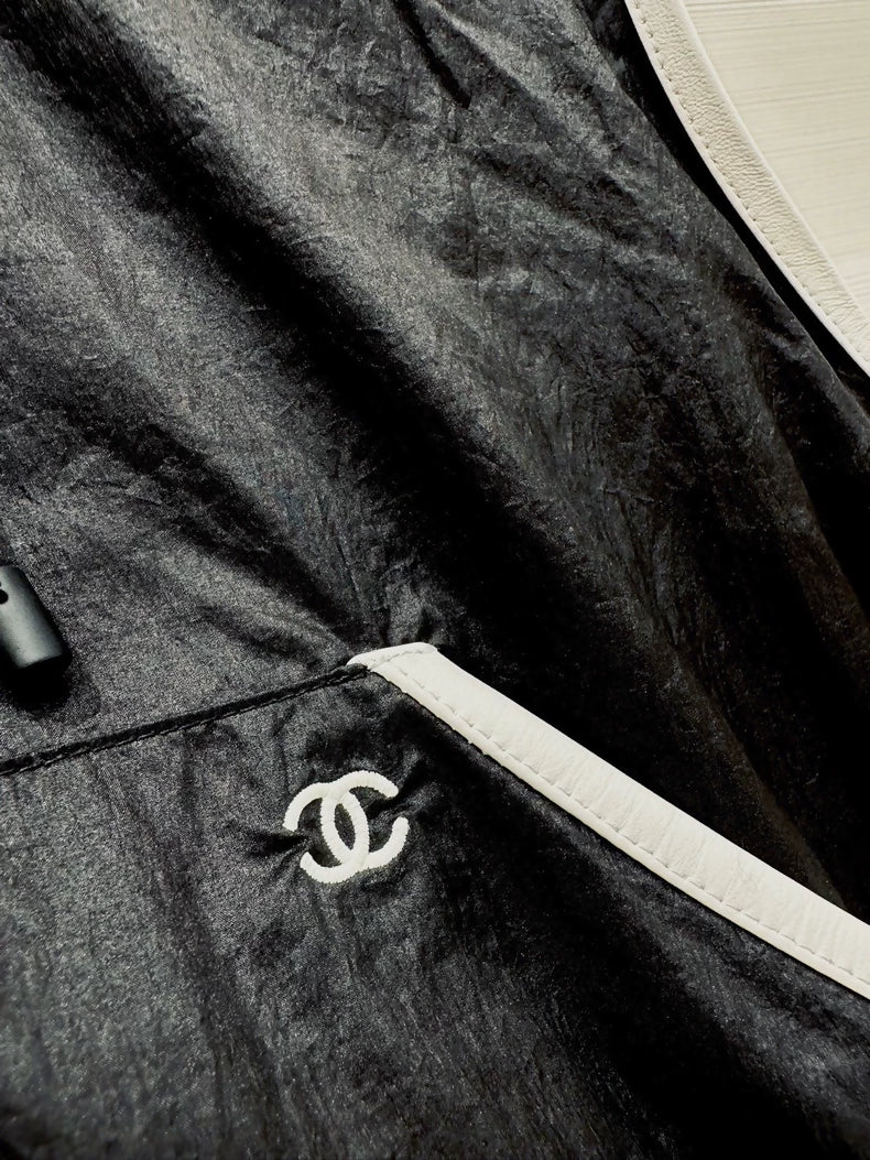 Chanel 26M Coco Beach black hooded vest, F36.