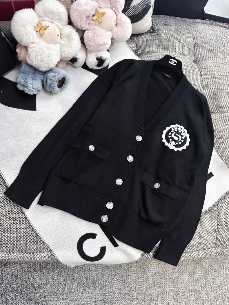 Chanel 23C Black Knit Cardigan with Embroidered Number 5 Badge