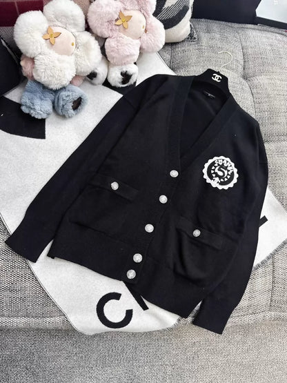 Chanel 23C Black Knit Cardigan with Embroidered Number 5 Badge
