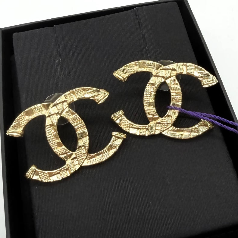 Chanel embossed gold double C stud earrings