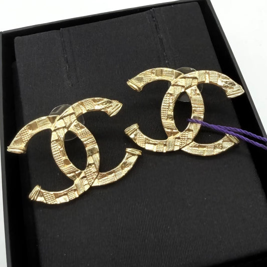 Chanel embossed gold double C stud earrings