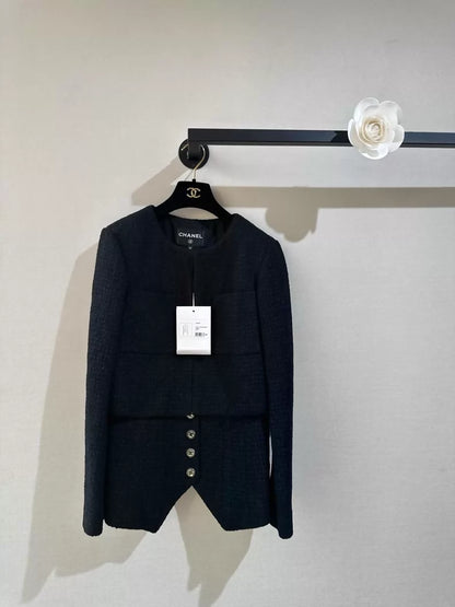 Chanel's early spring black two-piece tuxedo jacket