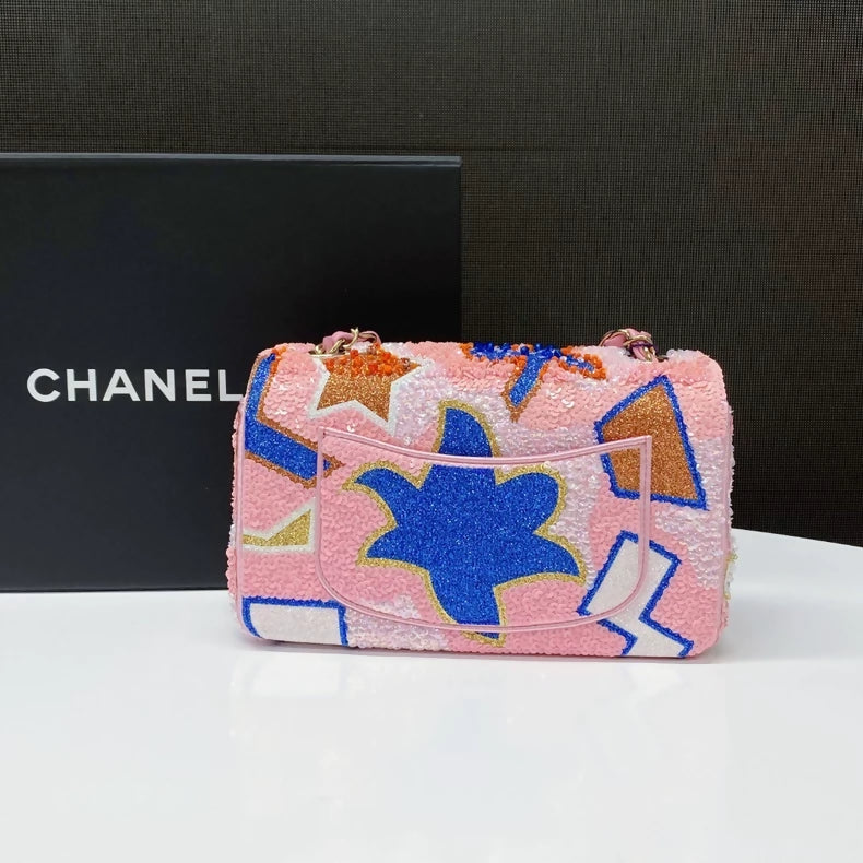CHANEL 23A featuring colorful beaded sequins and heavy embroidery