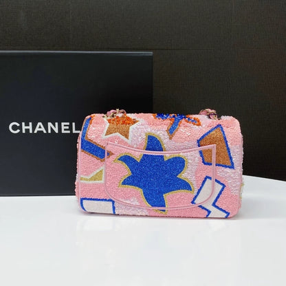 CHANEL 23A featuring colorful beaded sequins and heavy embroidery