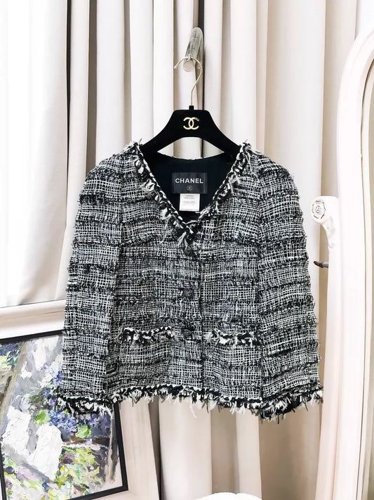 Chanel Spring/Summer 2011 black and white tweed jacket.