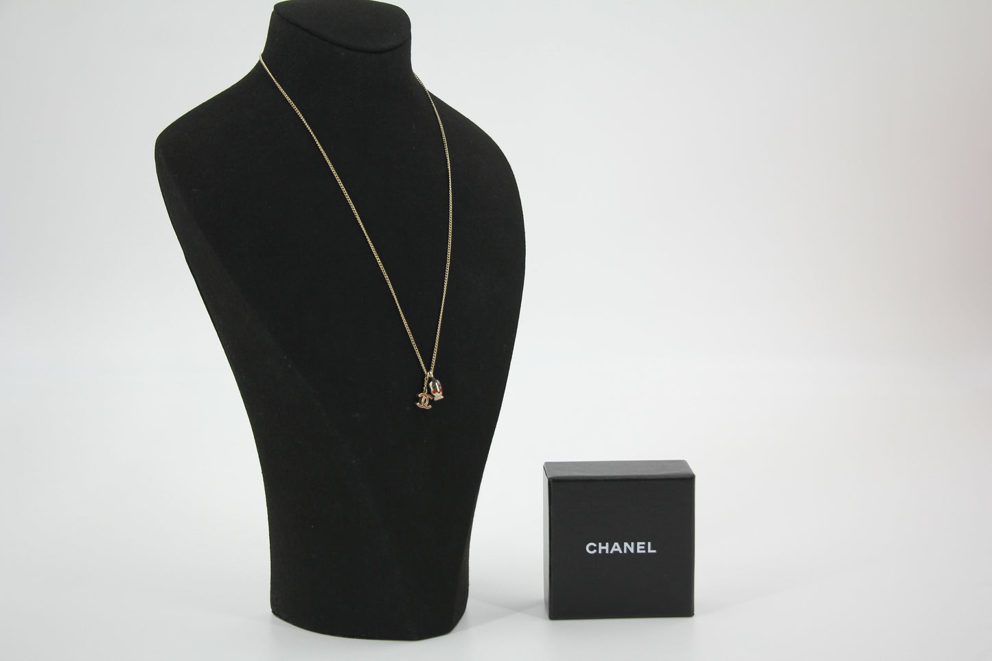 Chanel Vintage 05P Metal Doll Head & Red CC Necklace