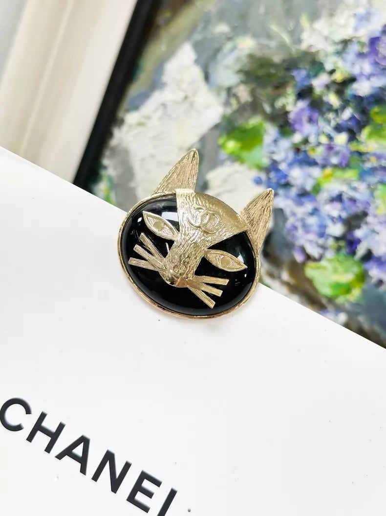 Chanel 19A black and gold double C logo cat brooch