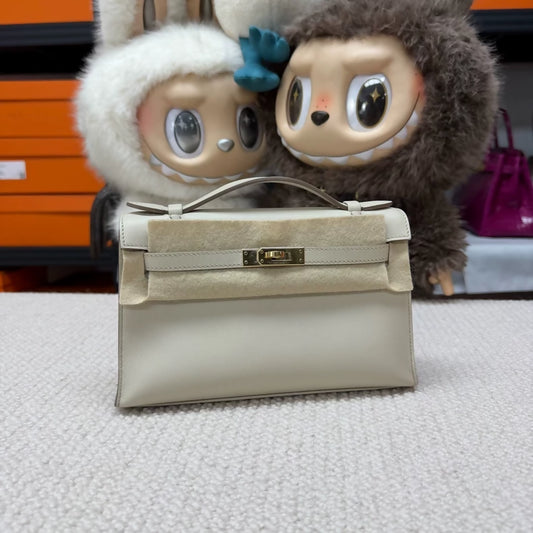 Hermes Kelly pochette craie Swift leather champagne gold hardware