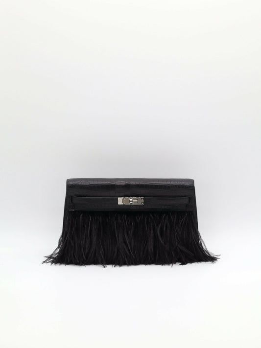Black clutch in matte crocodile-embossed leather with feather fringe and palladium-tone turn-lock closure