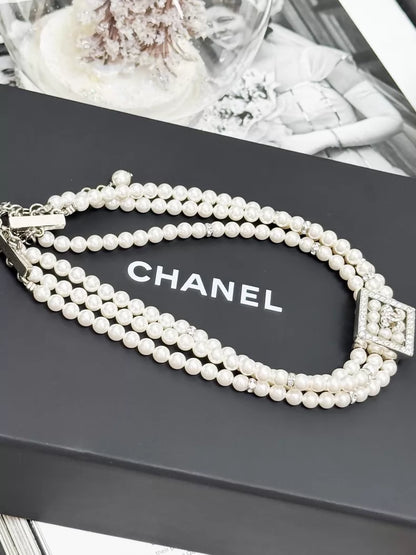 Chanel 24S pearls necklace with square rhinestones and a double-C logo