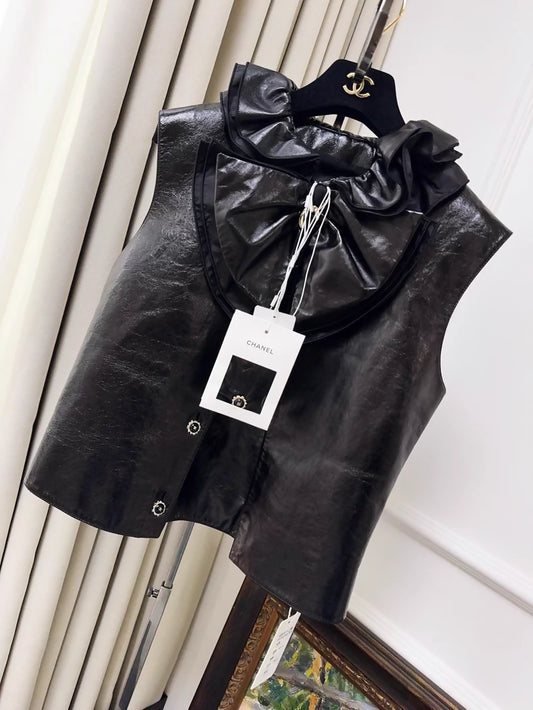 Chanel 25K black leather vest with bow and ruffled collar