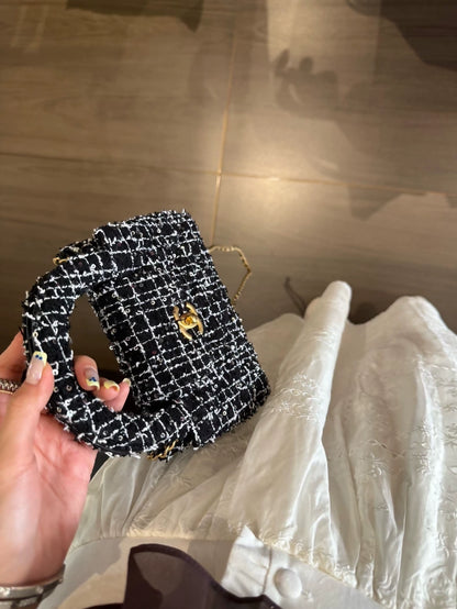 Chanel 24P Kelly Nano bag in black and white tweed