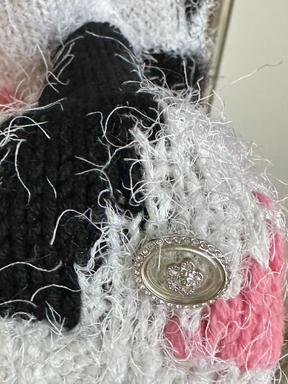 Chanel 23k runway pink, white, and black color-blocked floral sweater,