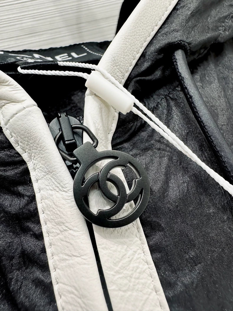 Chanel 26M Coco Beach black hooded vest, F36.