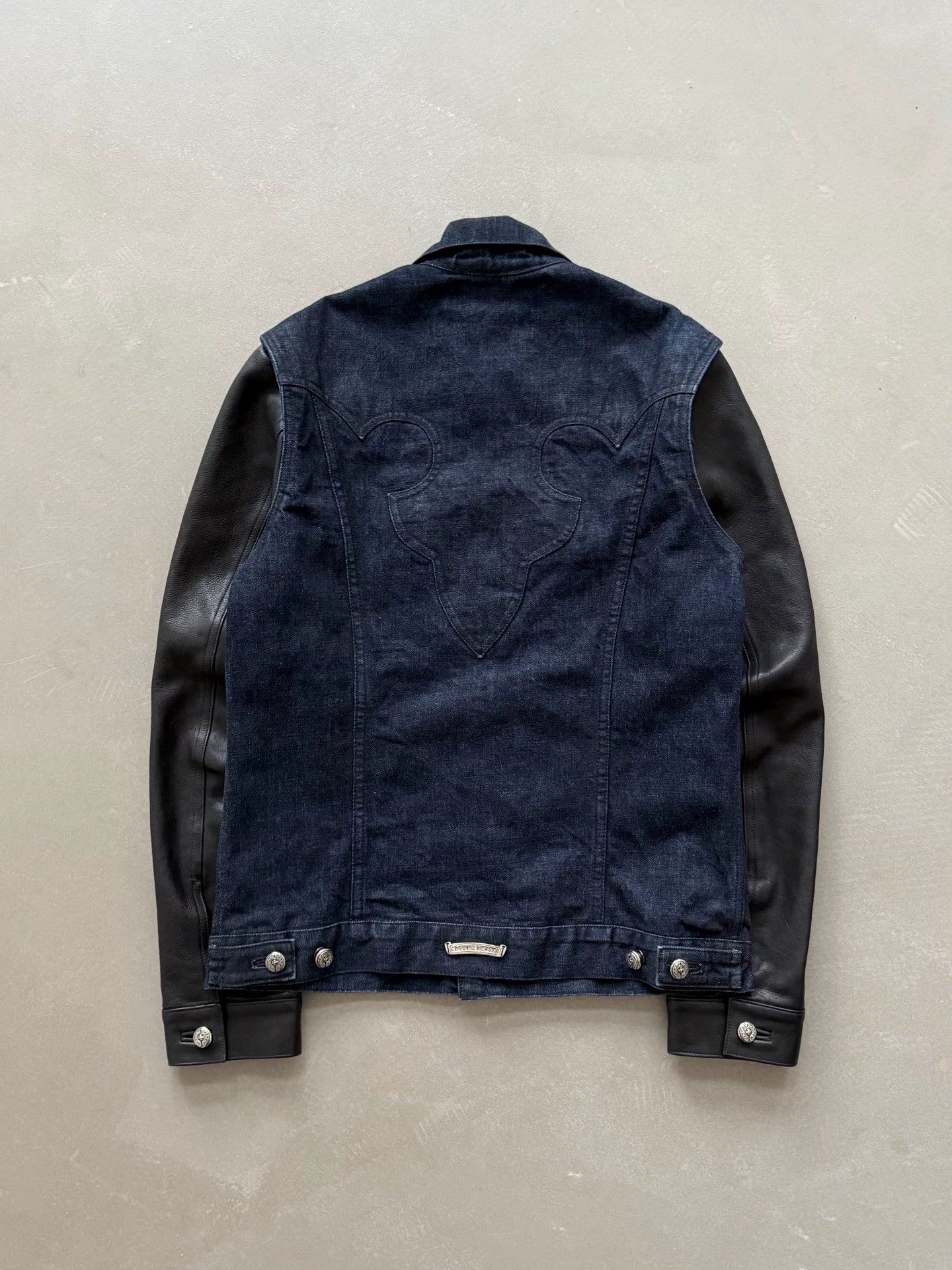 Chrome Hearts denim jacket with leather sleeves and a flame pattern on the back