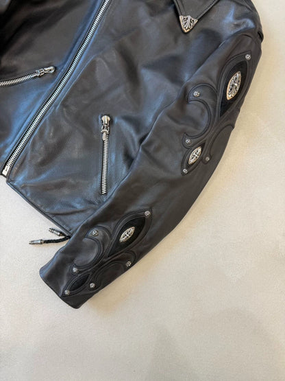Chrome Hearts leather motorcycle jacket with silver iris embellishments on the arms and back.