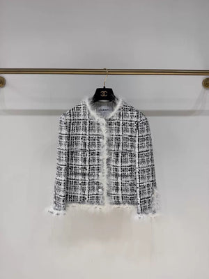 Chanel 25S black and white tweed jacket